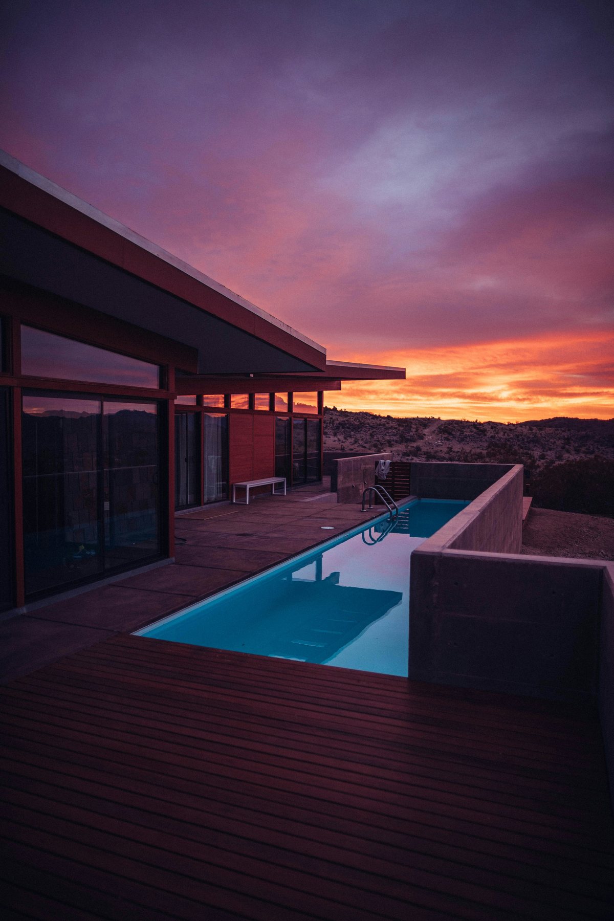 Modern retreat with a private pool at sunset